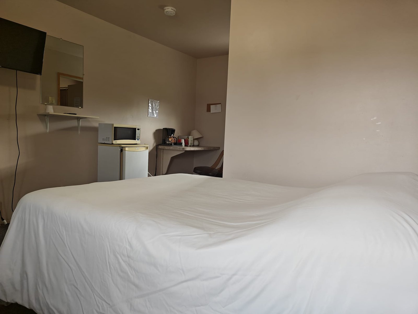 Sturgis Motel room with bed and guest amenities