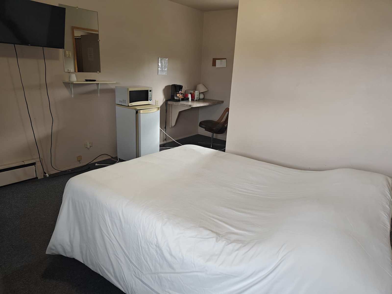 Sturgis Motel standard room with queen bed and amenities